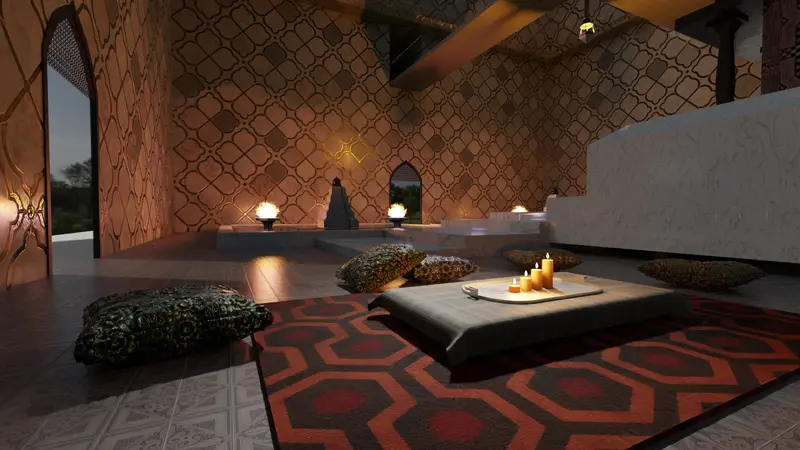 Zona de descanso con alfombra roja, cojines y mesa baja con velas